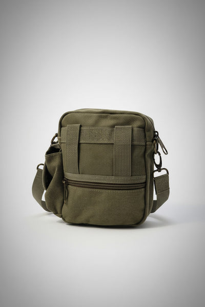 Green tactical bag on a light gray background