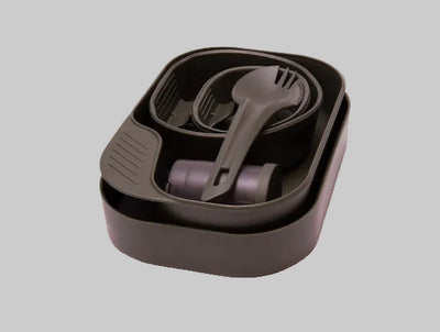 Set of cutlery in a brown carrying case on a light gray background