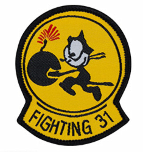 Patch with a black cat running from a bomb on a yellow background, labeled 'Fighting 31'.
