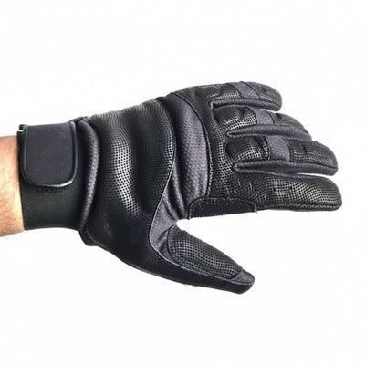 A single black motorcycle glove with textured grip panels and a wrist strap, shown worn on a person's hand against a plain white background.