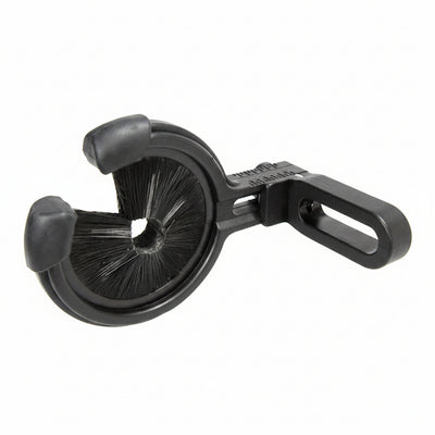 A black plastic and rubber door stopper with integrated cleaning bristles, shown on a plain white background.