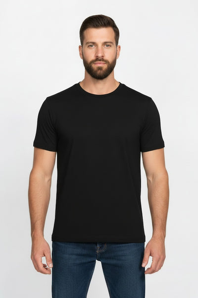 Man wearing a black t-shirt and blue jeans on a white background