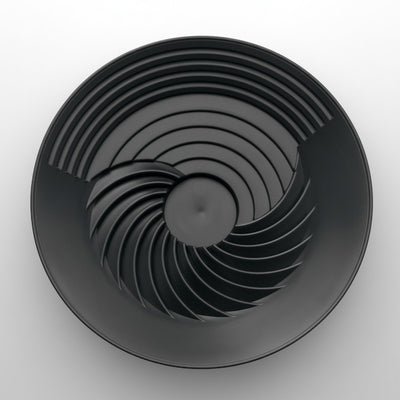 Black circular object with concentric rings on a white background