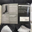Black socks with a visible label on a textured surface