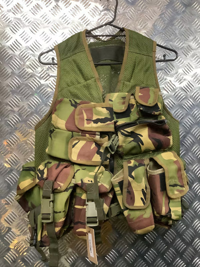 Camouflage tactical vest on a metal surface