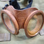 Vintage copper goggles with engraving on a green fabric background