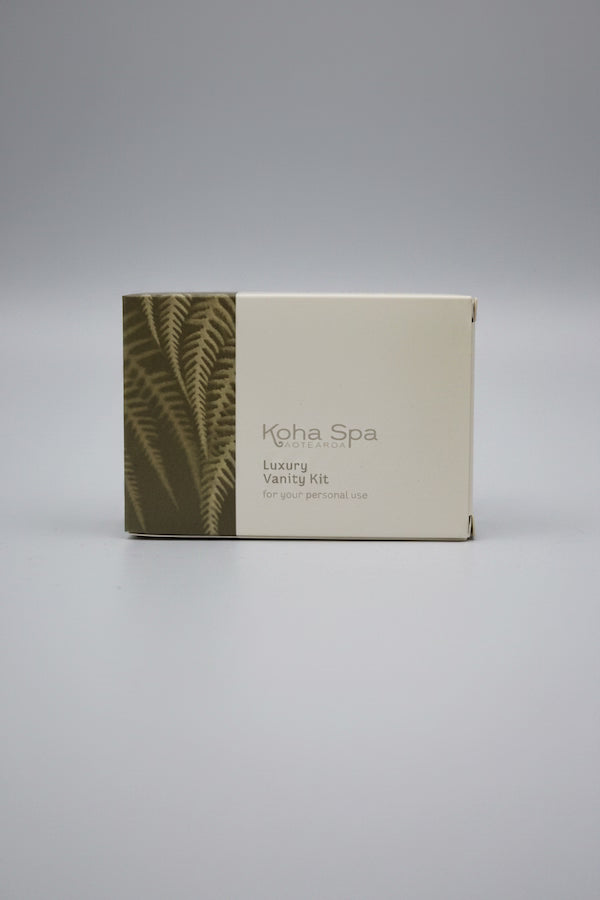 Koha Spa vanity kit packaging with fern design on a gray background