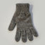 Gray knitted glove on a light gray background