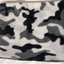 Camouflage-patterned blanket on a white background