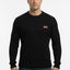 Man wearing a black sweater with a brown patch on a white background