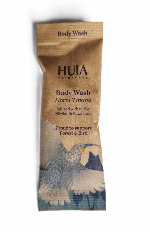 HUIA body wash packaging with bird illustration on a white background