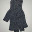 Gray knitted glove on a light gray background