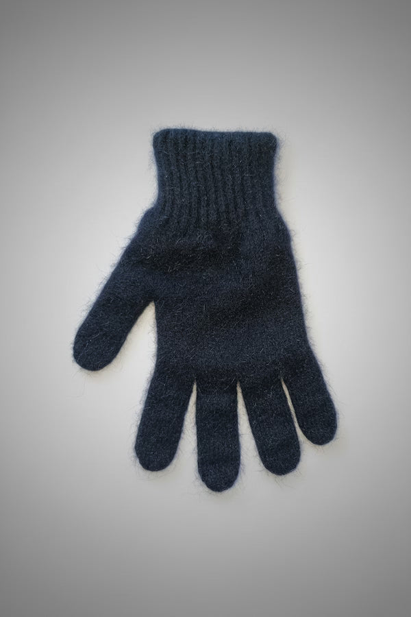 Blue knitted glove on a gray background