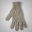 Knitted gray glove on a light gray background