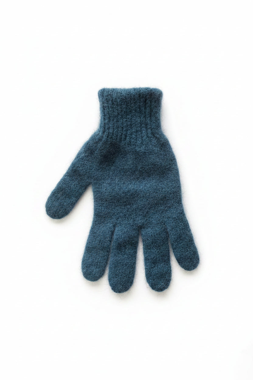 Blue knitted glove on a white background