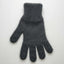 Dark gray knitted glove on a white background