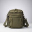 Green backpack on a white background