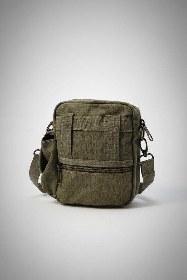 Green tactical bag on a light gray background
