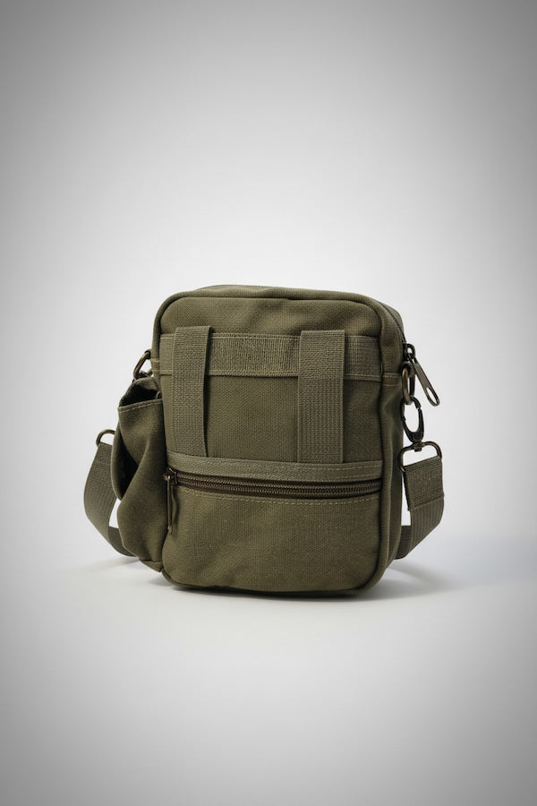 Green tactical bag on a light gray background