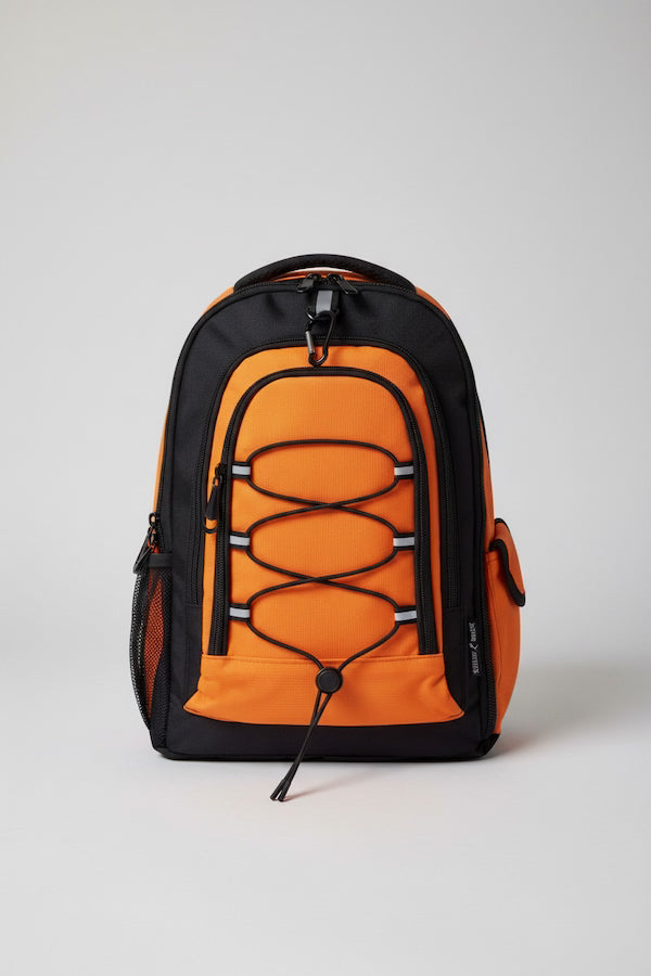 Orange and black backpack on a light gray background