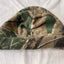 Camouflage-patterned beanie on a white background
