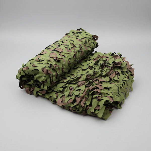 Rolled-up camouflage net on a gray background