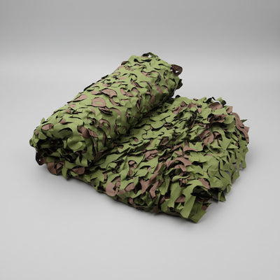 Rolled-up camouflage net on a gray background