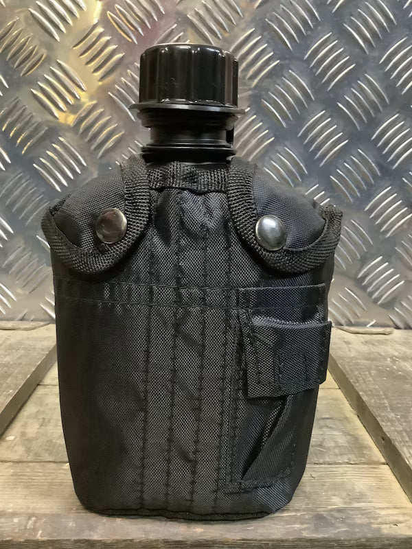 Black canteen with straps on a metallic background