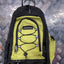 Green and black backpack with a visible brand tag on a metallic surface