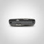 Multitool with carbon fiber pattern on a light gray background