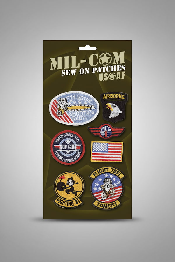 Packaged set of MIL-COM USAF military patches on a gray background