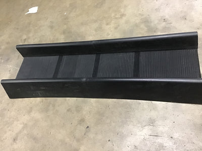 Black metal ramp on a concrete floor