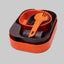 Orange and black camping cookware set on a gray background