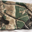 Camouflage-patterned blanket on a white background