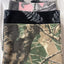 Four camouflage-patterned blankets stacked on a white background
