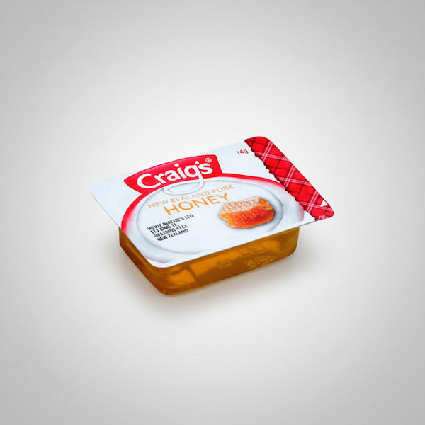 Packaged honey with 'Craig's' branding on a white background