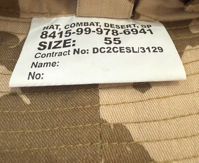 Label on a camouflage hat with text and numbers