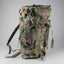 Camouflage backpack on a gray background