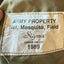 Vintage Army property label on a military uniform, featuring the brand 'Sigma'.