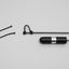 Black and silver cylindrical device with a rope on a gray background