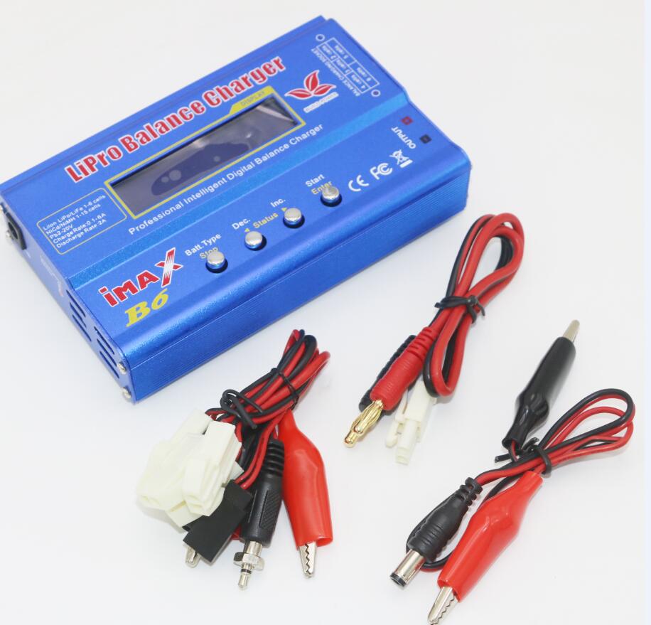 Blue battery charger with cables on a white background