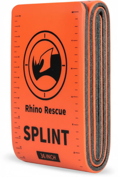 An orange trauma splint with black printed text and graphics, including 'Rhino Rescue SPLINT' and '36 INCH'. The product is shown standing upright with its gray foam padding visible on the right side.