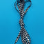 Checkered shoelace tied in a knot on a blue background