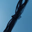 Black shoelace on a blue background
