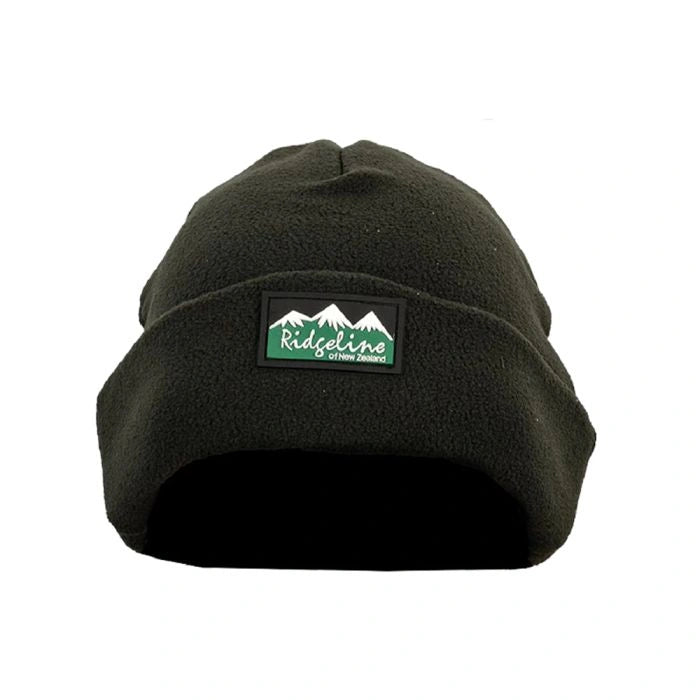 Black beanie with a green and white logo on a white background