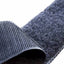 Close-up of a textured gray sock with a white background