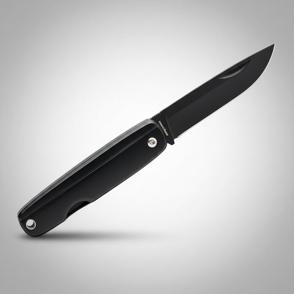 Black folding knife on a gray background