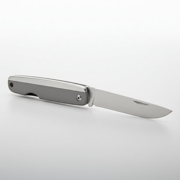 Foldable knife with metallic blade and handle on a white background