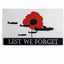 Flag with red poppy, airplanes, and 'Lest We Forget' text on a white background