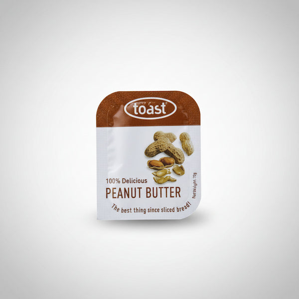 Pouch of peanut butter with 'toast' branding on a white background